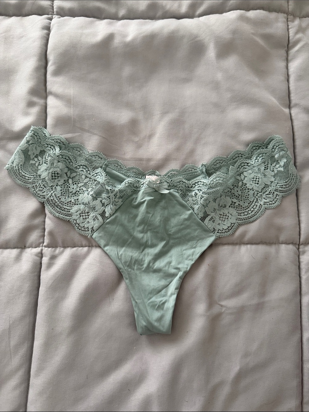 Medium teal Victoria’s Secret lace and satin thong